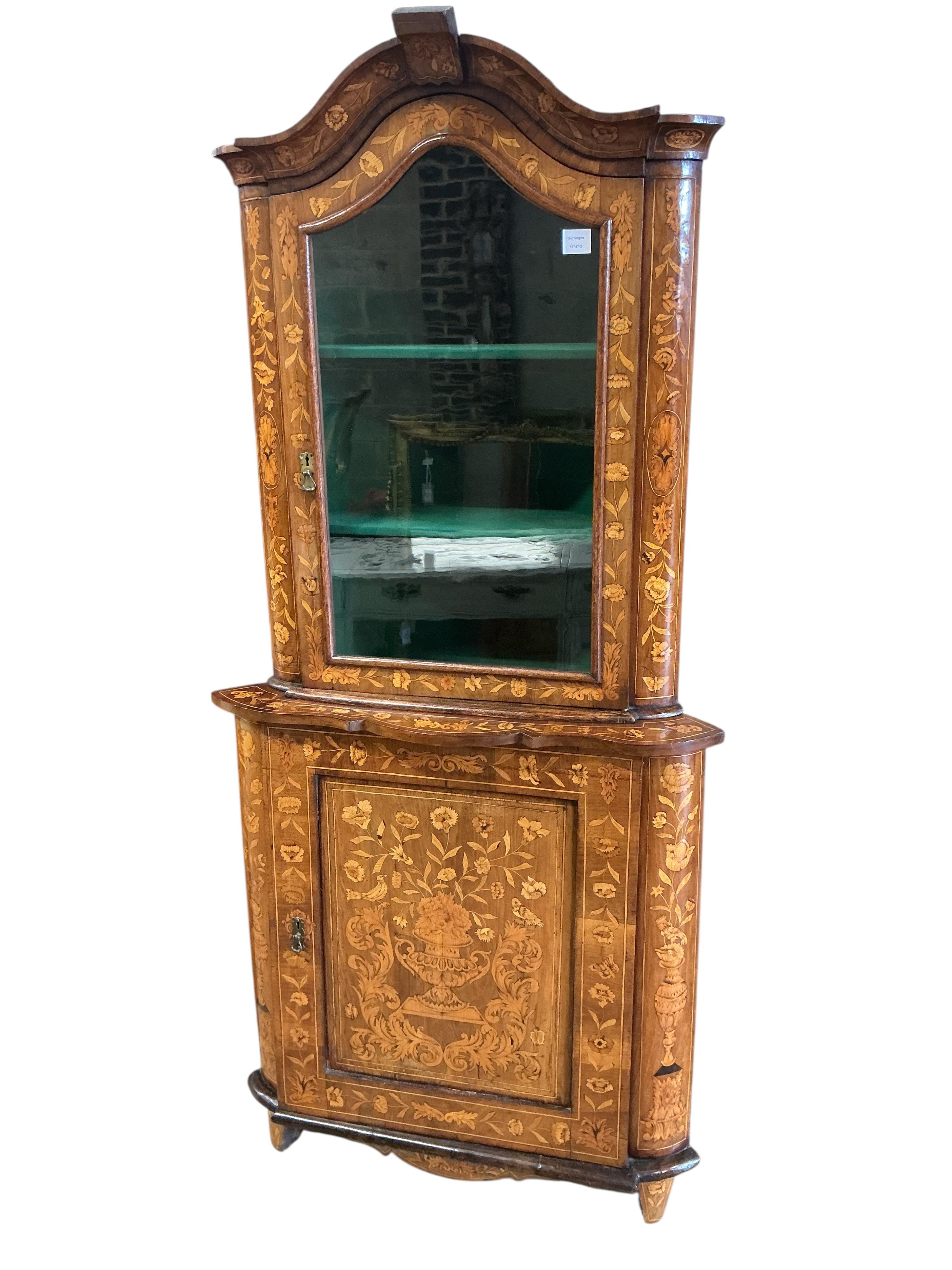 An early 19th century Dutch floral marquetry inlaid walnut standing corner cabinet, width 87cm, depth 53cm, height 192cm